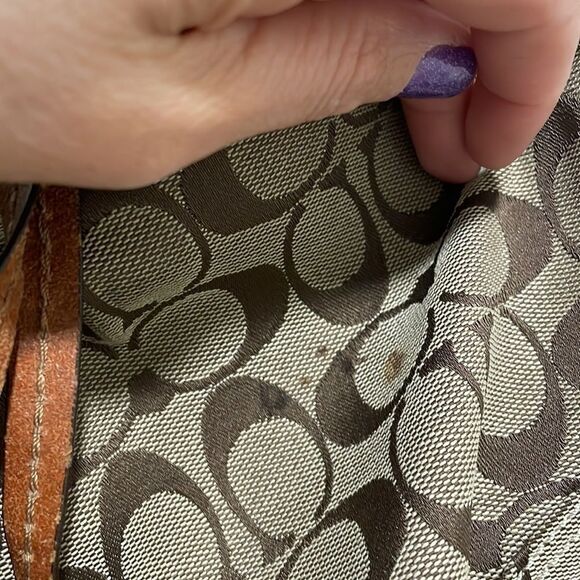 Coach woman’s brown canvas with twisted brown leather strap. - Picture 4 of 11